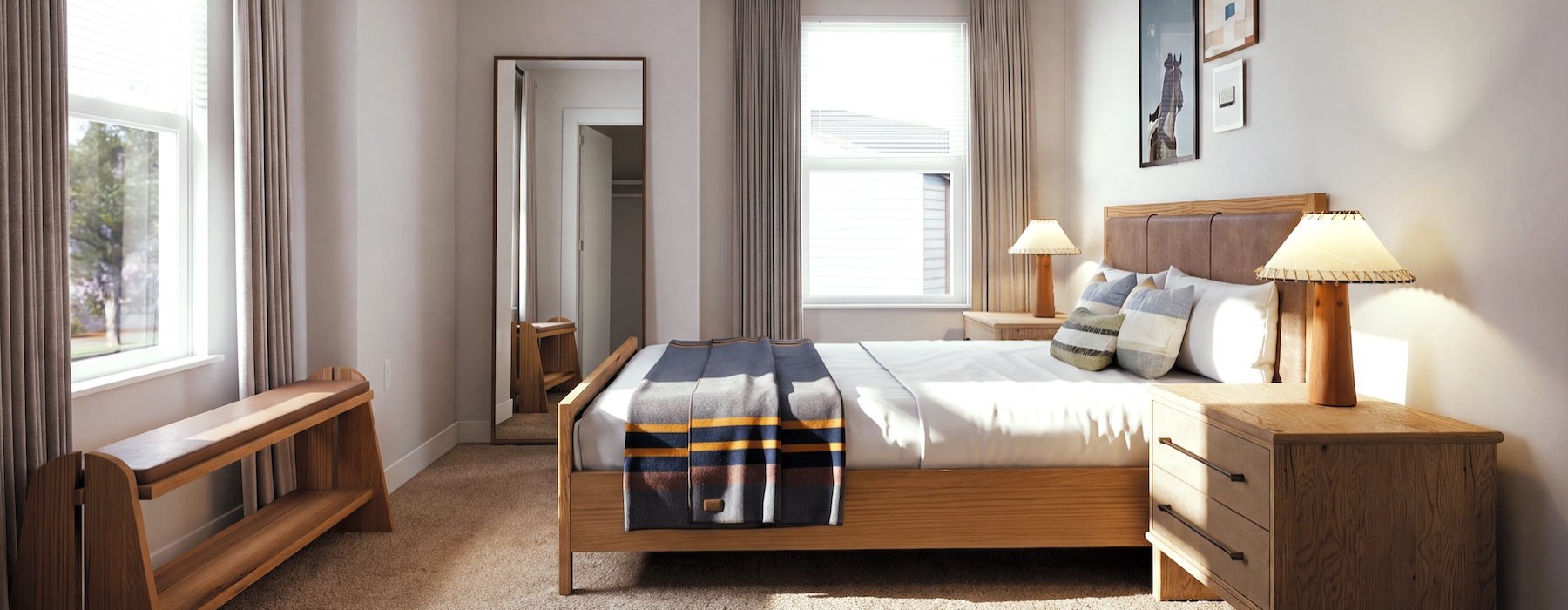 a bedroom with a bed and a bench