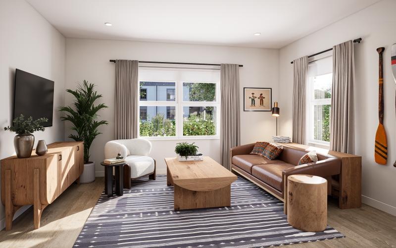 a living room with a couch, tv and a coffee table